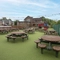 Exterior play area and beer garden of a pub with a seating area.