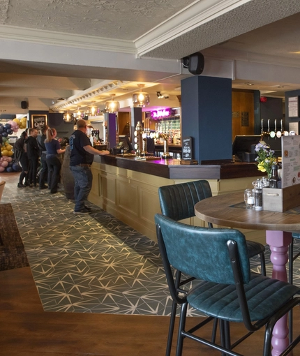 Interior seating and restaurant area next to the bar