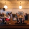 A group of people enjoying drinks within the interior restaurant seating area during The Durell Arms launch party.