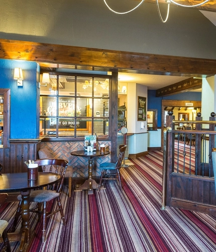 Interior dining area of a pub.