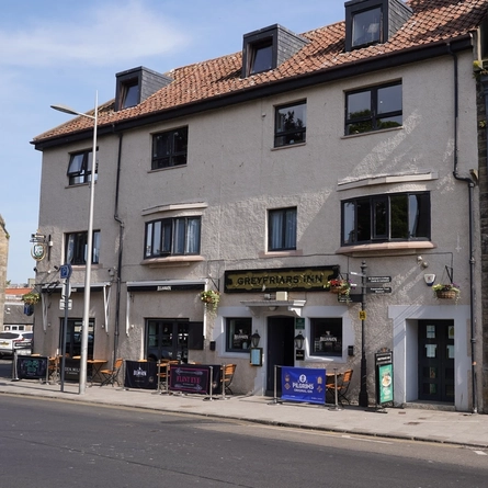 The exterior facade and outdoor seating area at The Greyfriars Hotel.