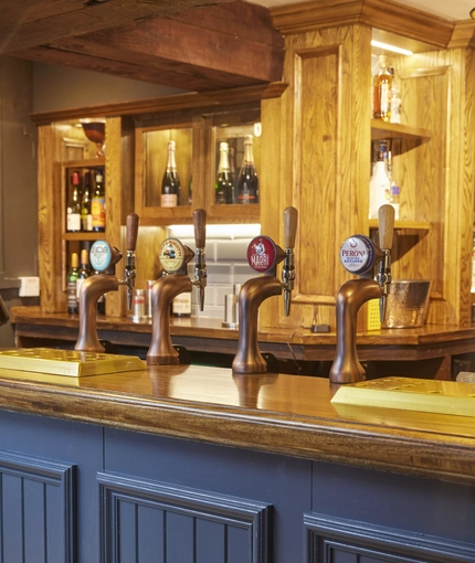 The beer pumps on the bar of The Castle Hotel.