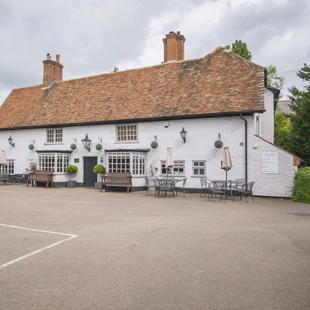 The exterior facade with seating area at the Crown.