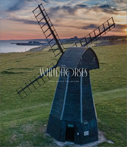 A banner advertising the White Horses Hotel.