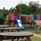 exterior beer garden of a pub with a play area and a seating area