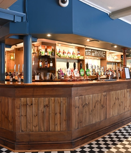 The interior bar with TV at The Greengage.