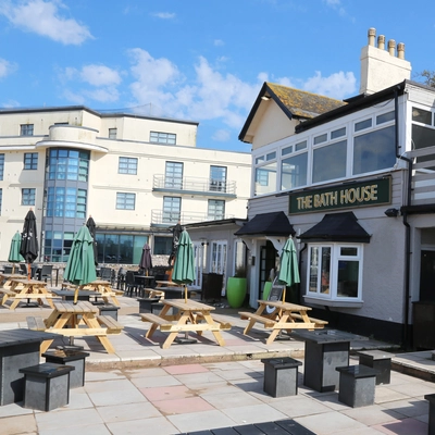 Exterior beer garden of a pub with a dining area.