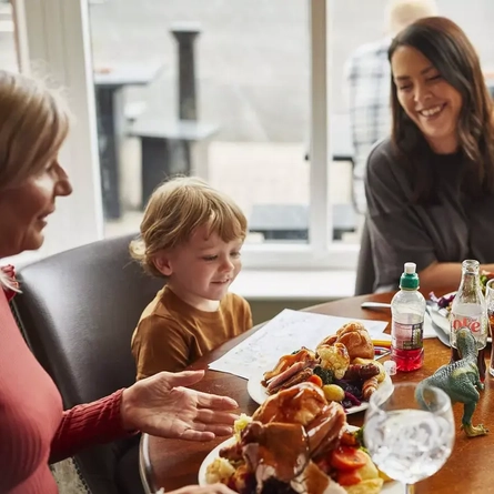 A family enjoying a carvery in the pub