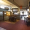 Interior shot featuring the bar, seating area and dart board
