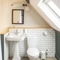 An ensuite bathroom with bath and overhead shower at The Red Lion, Adderbury.