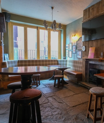 Interior shot of the restaurant seating area and TV