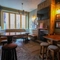 Interior shot of the restaurant seating area and TV
