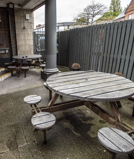 Exterior beer garden with a picnic bench
