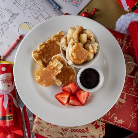 An interior shot of food served for the 'Breakfast With Santa' event for Christmas at a Flaming Grill venue.
