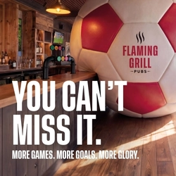 A banner promoting the new football season at Flaming Grill venues. The banner shows an interior of a Flaming Grill-branded sports bar featuring a giant football-shaped wall installation beside the bar. Large white text reads “YOU CAN’T MISS IT.” with smaller text underneath stating “MORE GAMES. MORE GOALS. MORE GLORY.” A television screen showing a football match is visible in the background above beer taps and shelves of bottles.