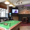 interior seating area and pool table of the pub