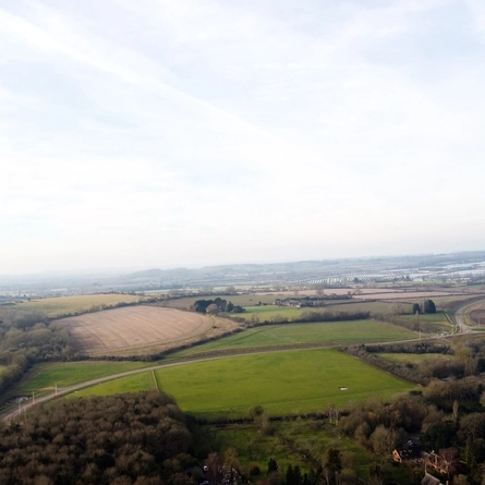 An aerial view of fields, trees and roads near The Bell at Stratford-Upon-Avon.