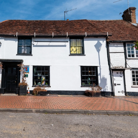An exterior shot of the facade & signage at the Grasshopper in Wokingham.