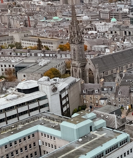 An aerial view of the exterior of Molly Malones in Aberdeen, as well as the surrounding streets and coast.