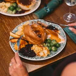 A plated meal on a festive decorated table.