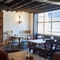The restaurant area of The Bear, with a fireplace amongst the tables.