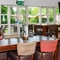 Interior dining area of a pub with a TV.