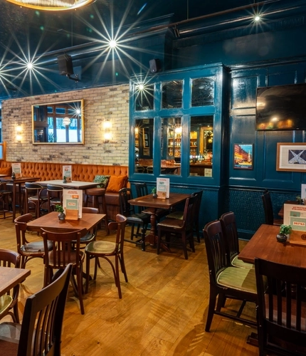 The interior seating area with TV at the Garrick Arms in Charing Cross.