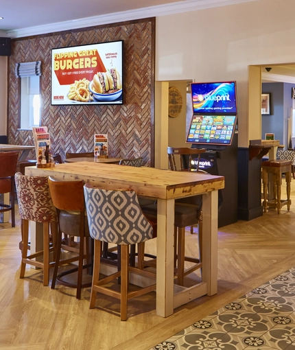 A dining area  with  pool table, Gaming machine, dartboard and TV at the Snipe.