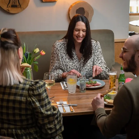 Three people eating together in a pub restaurant for Mother's Day