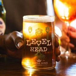 A hand holding a pint of Level head at Ye Olde Trip To Jerusalem.