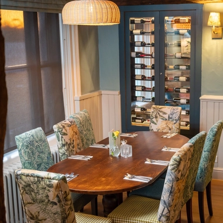 A table next to a wine fridge in the Berkshire Arms.