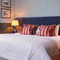 Double bed in hotel room with a sofa bed 