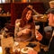 An image focusing on 2 people sat at a table within the interior restaurant seating area enjoying food and drinks at The Black Swan.