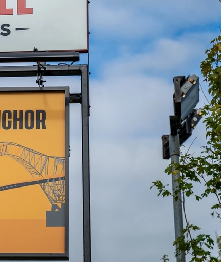 A close up view of the exterior sign at the Arch & Anchor. 
