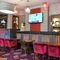 interior dining area of a pub with a TV