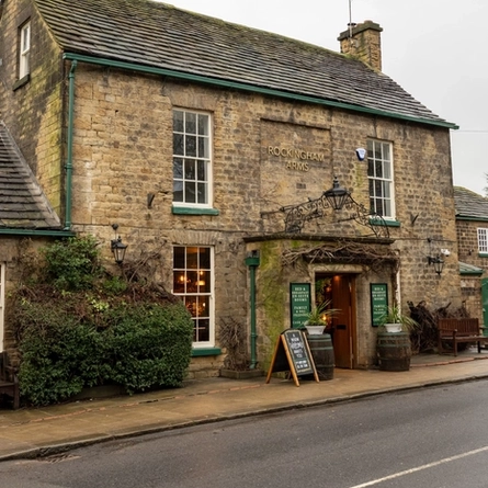 The exterior and entrance of The Rockingham Arms.