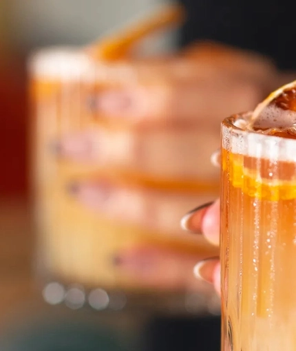An interior shot of people enjoying drinks at the Ubiquitous Chip in Glasgow.