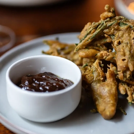 Samphire pakoras with a pot of date and tamarind chutney