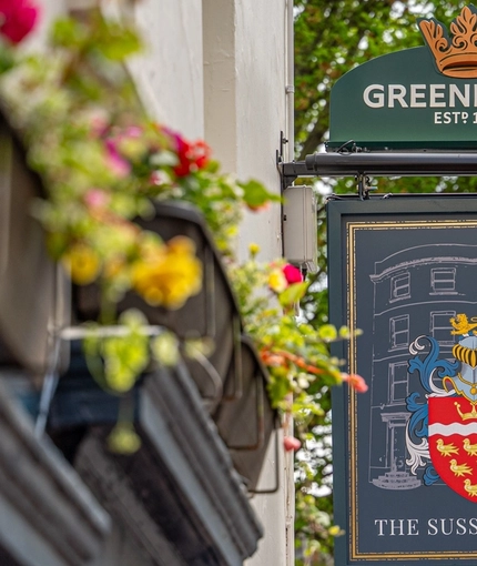 The exterior signage of The Sussex Arms in Brighton.