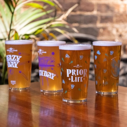 Glasses of Prior Life and Hazy Day beers, on a table.