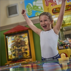 A child playing in the indoor play area at Farmhouse Inns