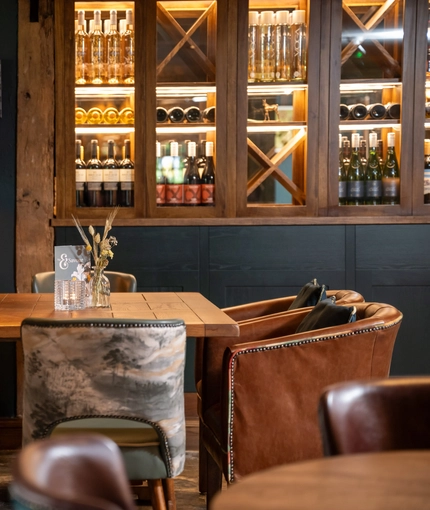 A table in the restaurant of the Three Horse Shoes.