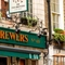 A close up view of the exterior facade and signage of The Two Brewers in Covent Garden.