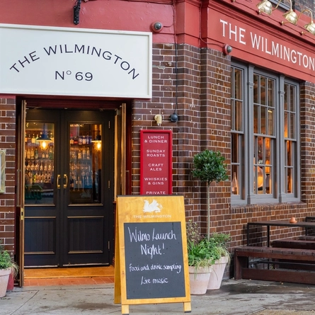 The exterior facade and seating area during the Opening Night at The Wilmington