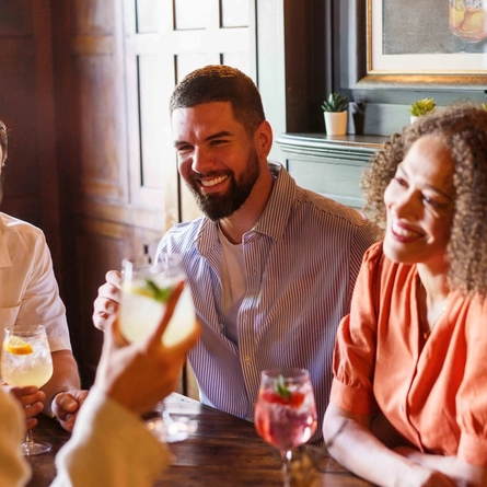An interior shot of people enjoying summer drinks at Urban Core & Heritage venues.