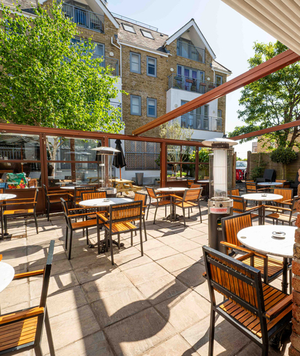 The exterior beer garden seating area at Ye Olde Mitre in Barnet.