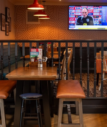 The interior restaurant and seating area with TV at the Man of Gwent.