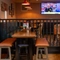 The interior restaurant and seating area with TV at the Man of Gwent.