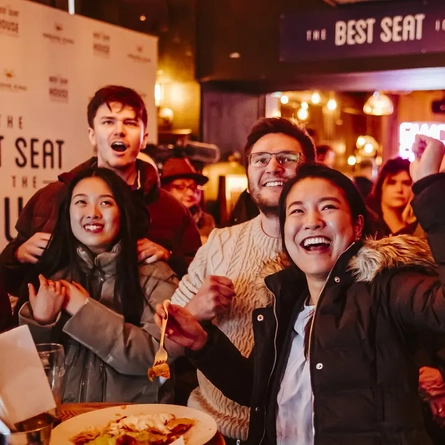 People cheering in the pub