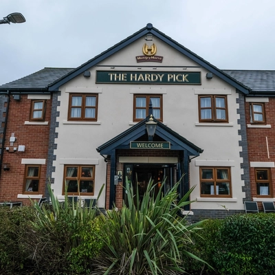 exterior facade of a pub with a seating area